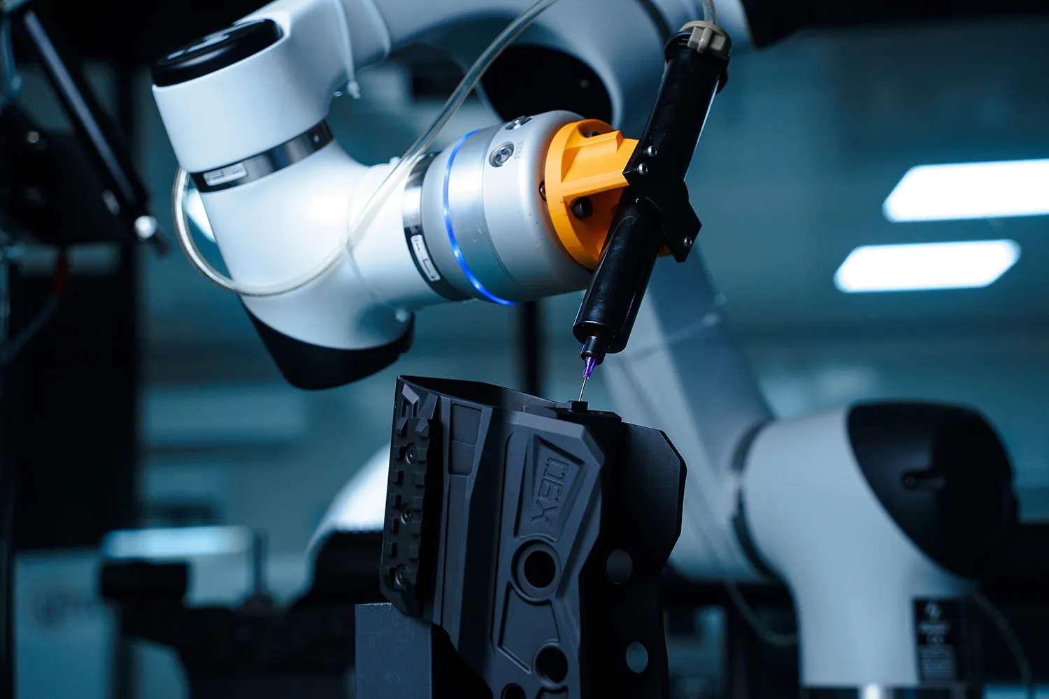 From HRS to MTN X90: 3E's reflex sight family 5 3E MTN X90 sight undergoing recoil testing on a robot-controlled test rig