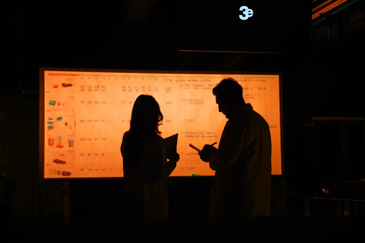 3E engineers conducting a design review at a workstation