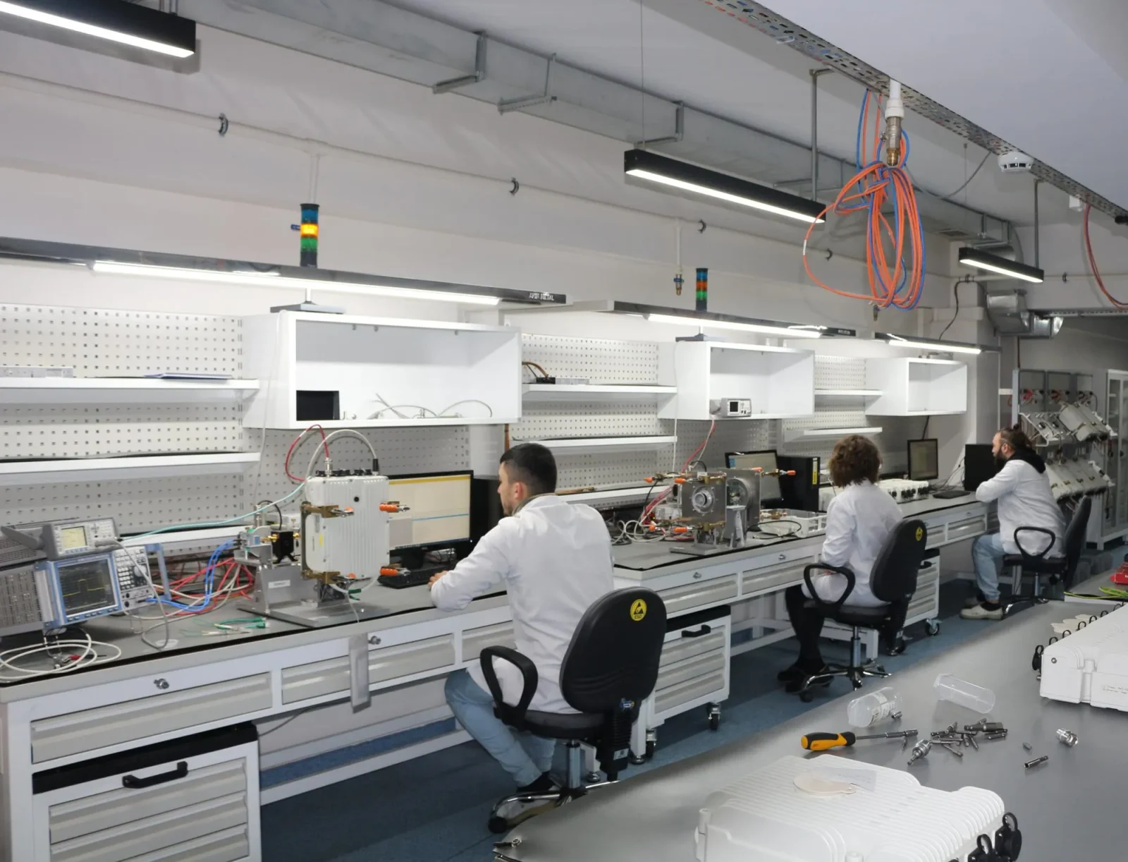 Engineers working on the RF production and test line at CTech