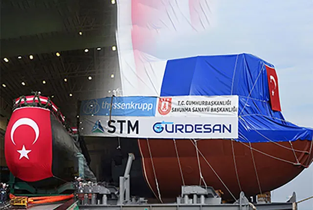 Submarine section draped with the Turkish flag at a shipyard launch ceremony